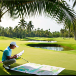 **

Prompt: Thai golfer meticulously studying the course map before a round, highlighting distances and hazards. Lush green fairway, palm trees in the background, bright sunlight. Focus on strategic planning.

**